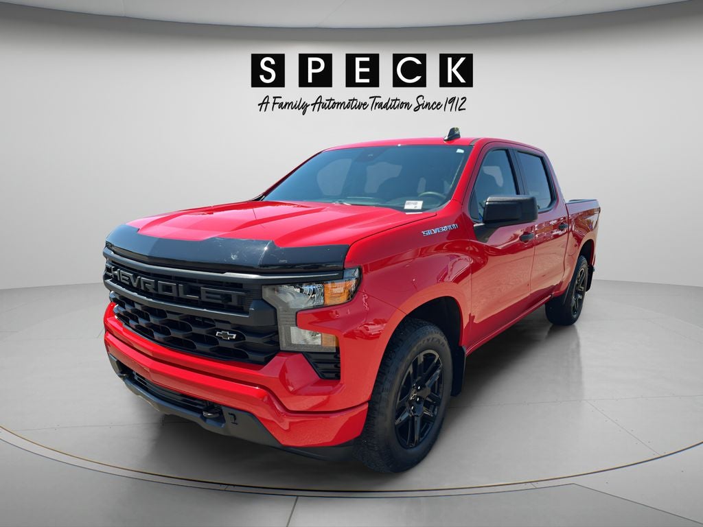 2024 Chevrolet Silverado 1500 Custom in Red Hot — front three-quarter view