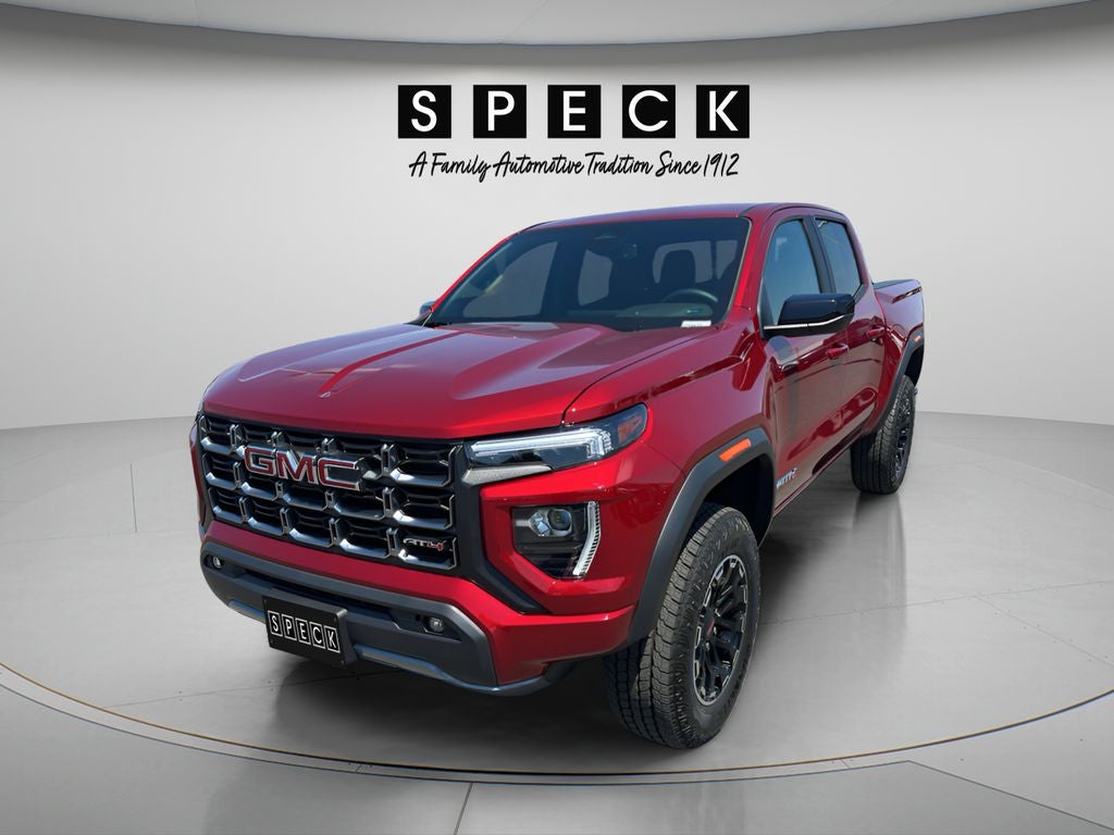 2026 GMC Canyon AT4 in Volcanic Red Tintcoat — front three-quarter view