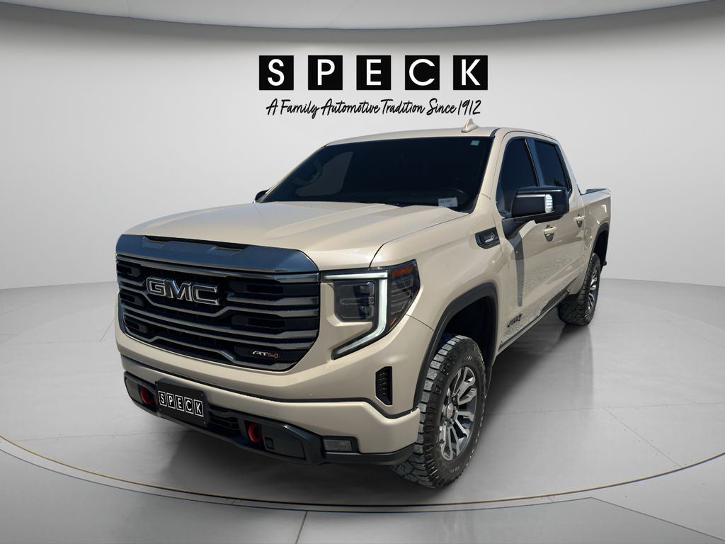 2022 GMC Sierra 1500 AT4 in Desert Sand Metallic — front three-quarter view